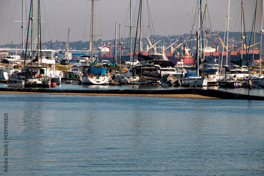 Fototapeta premium Yachts in Durban Harbour with Cargo Ships across Bay