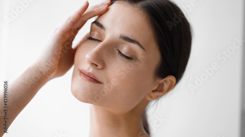 Wallpaper Mural Beautiful woman face
close up
brunette
natural make up happy smile natural beauty over white Torontodigital.ca