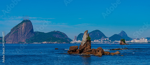 Niterói, Rio de Janeiro, Brazil - CIRCA 2021: Image of rock formations (stones), with texture and sharpness, on the beach during the day photo