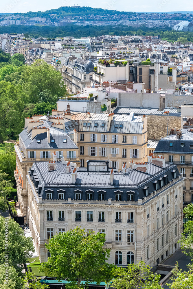Obraz premium Paris, beautiful Haussmann facades and roofs in a luxury area of the capital, view from the triumph arch
