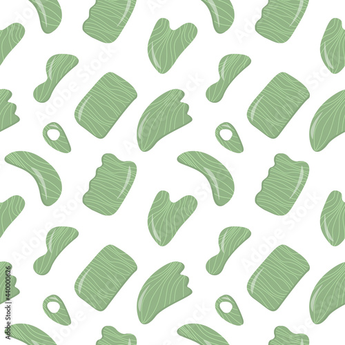 Seamless pattern with Gua Sha Jade Scraping Massage tool. Natural green stone scraper in different shapes. Trendy popular skin care. Vector background in flat style.