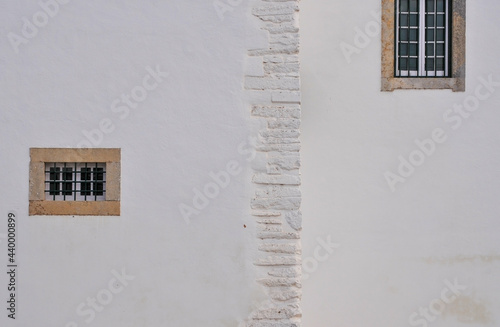 2 windows on a white wall, shot in Faro, Portugal