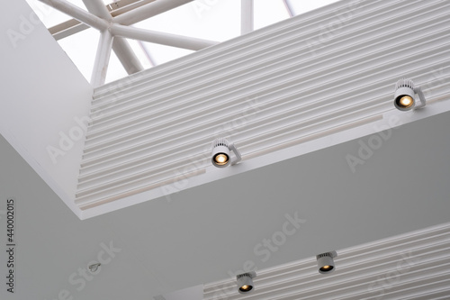 Interior downlight on the ceiling of a white building photo