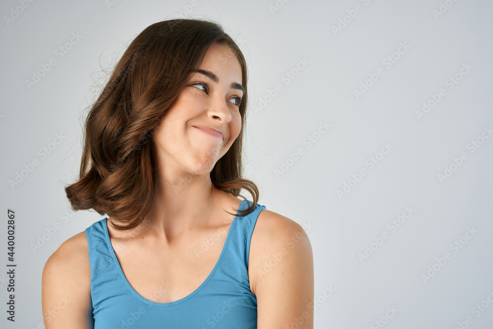 joyful woman in blue t-shirt fashion hairstyle close-up fun joyful woman in blue t-shirt fashion hairstyle close-up fun