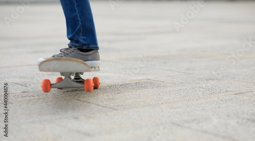 Skateboarder legs skateboarding at outdoors