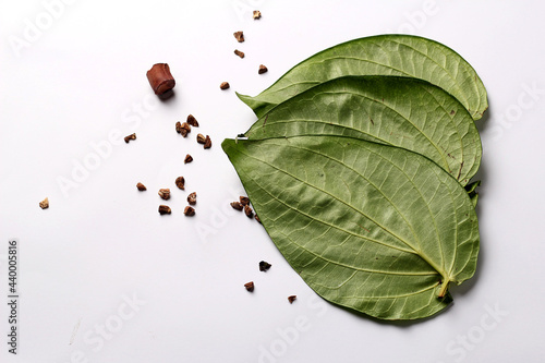 Ingredients of indian traditional meetha masala paan which is a mouth freshener and digestive. Sauf, tutti frutti, supari, clove, gulqand, coconut powder etc added in Betel leaves & chewed. Pandaan. photo