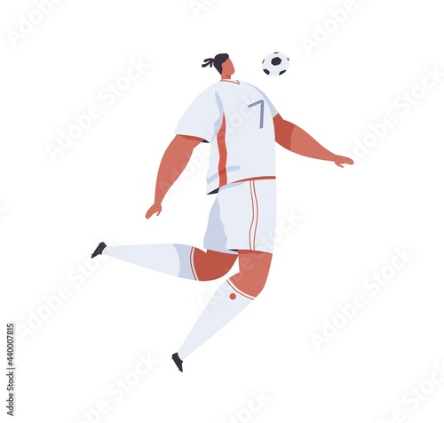 Football player jumping and trapping soccer ball with chest. Professional foo...