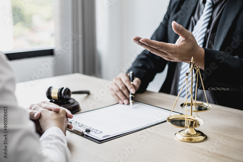 Attorneys advising in cases where a client has been defrauded by a defendant who is a business partner forming a joint company, advising on litigation and gathering evidence. Fraud case concept. photo