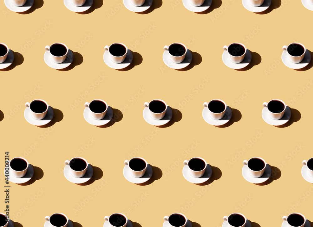 Obraz premium Pattern of coffee cup and plate, shadow of sun on beige terracotta background