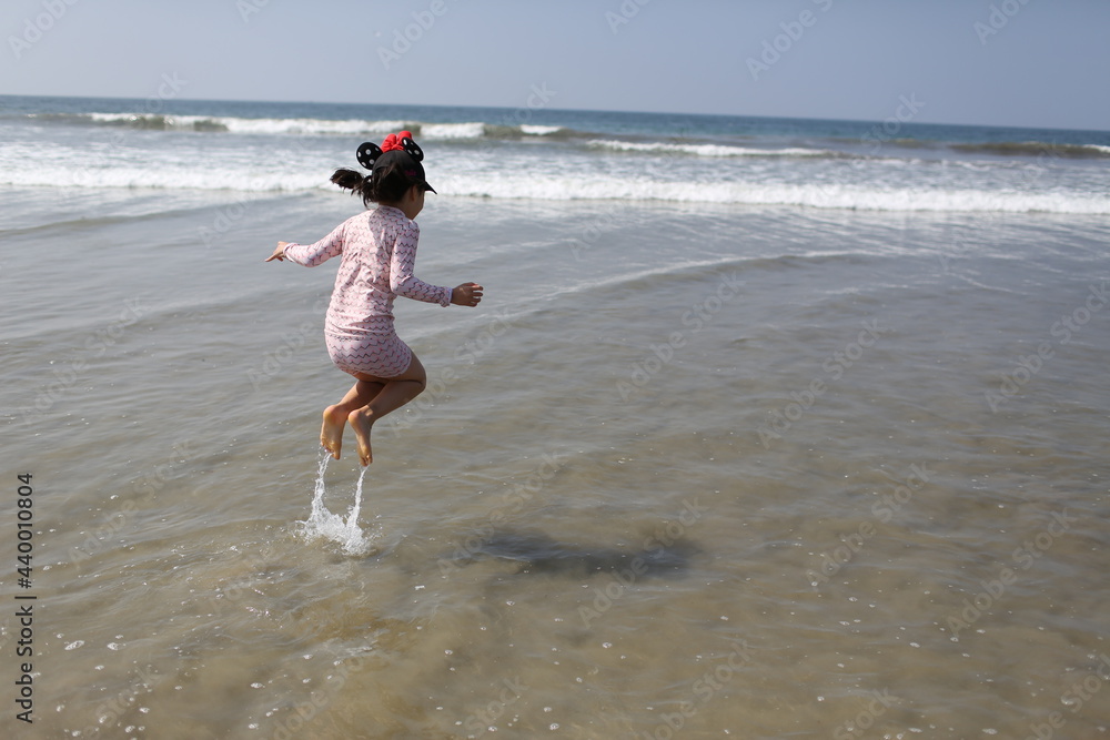 Full Length Rear View Of Girl On Beach Stock Photo | Adobe Stock