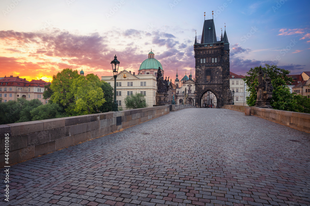 Prague, Charles Bridge. Cityscape image of iconic Charles Bridge with Old Town Bridge Tower in Prague, Czech Republic at sunrise.