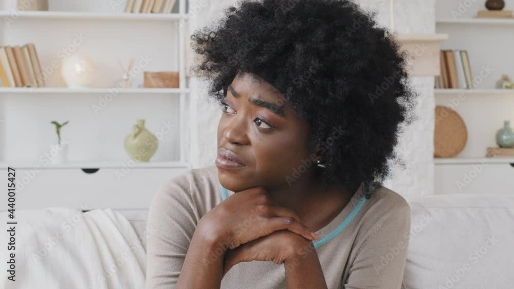 Depressed worried African woman feeling nervous, thinking about problem, lost in sad thoughts having personal life or health concerns feels upset. Break up, divorce, psychological disorder concept Depressed worried African woman feeling nervous, thinking about problem, lost in sad thoughts having personal life or health concerns feels upset. Break up, divorce, psychological disorder concept