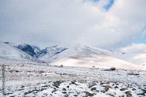 mountain under clouds and snow in winter
