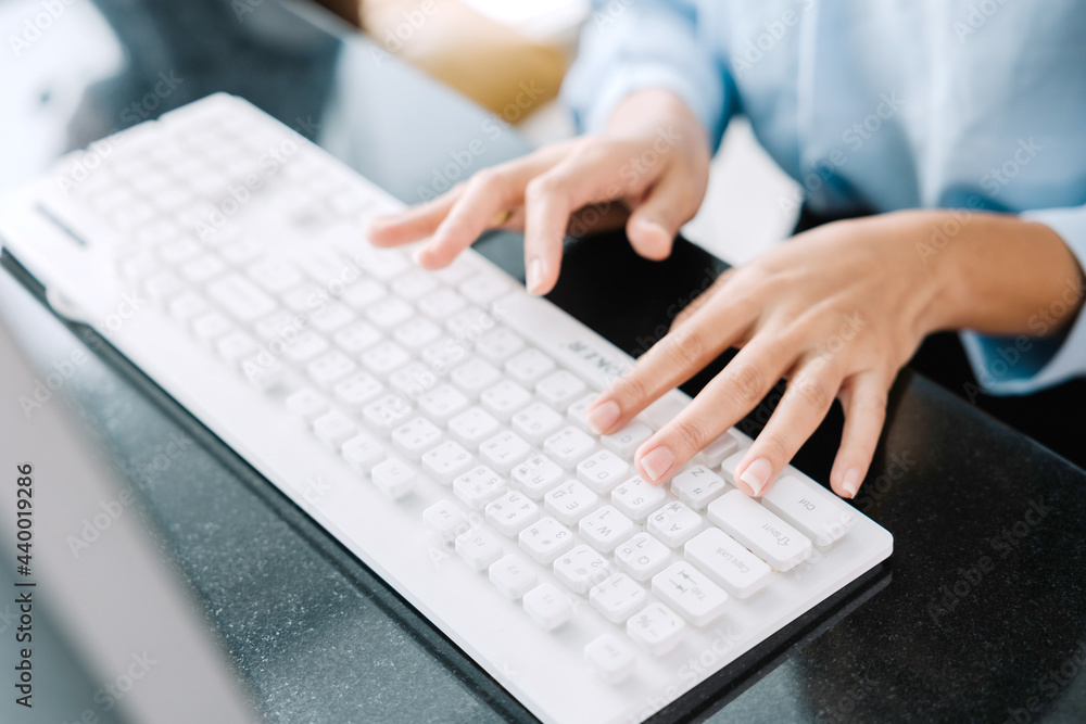 Working at home with laptop woman writing a blog. Female hands on the keyboard Working at home with laptop woman writing a blog. Female hands on the keyboard