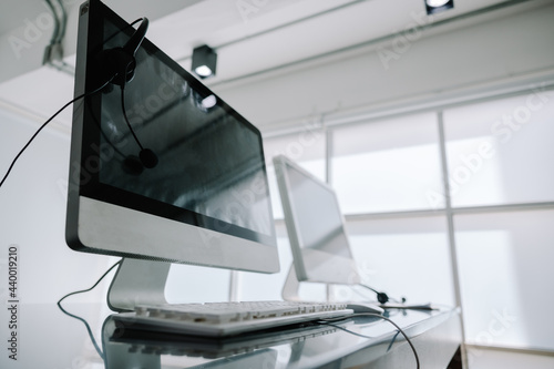 Communication support, call center, and customer service help desk. headset on a laptop computer keyboard.