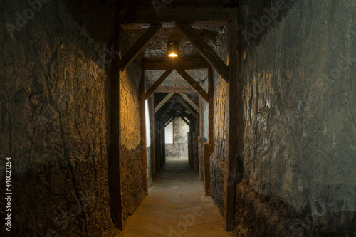 Long lighten tunnel through gypsum mine with wooden beams in north of Thailand.
