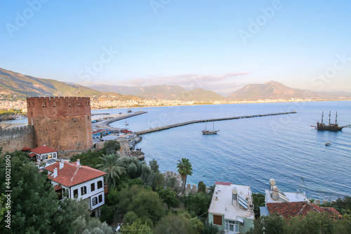 Landscape view of Alanya from red Castle hill, Turkey, marina, sea and mountains from the top of the fortress wall.