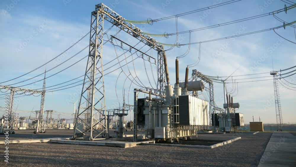Electric power station with lofty metallic pillars and square transformators Electric power station with lofty metallic pillars and square transformators