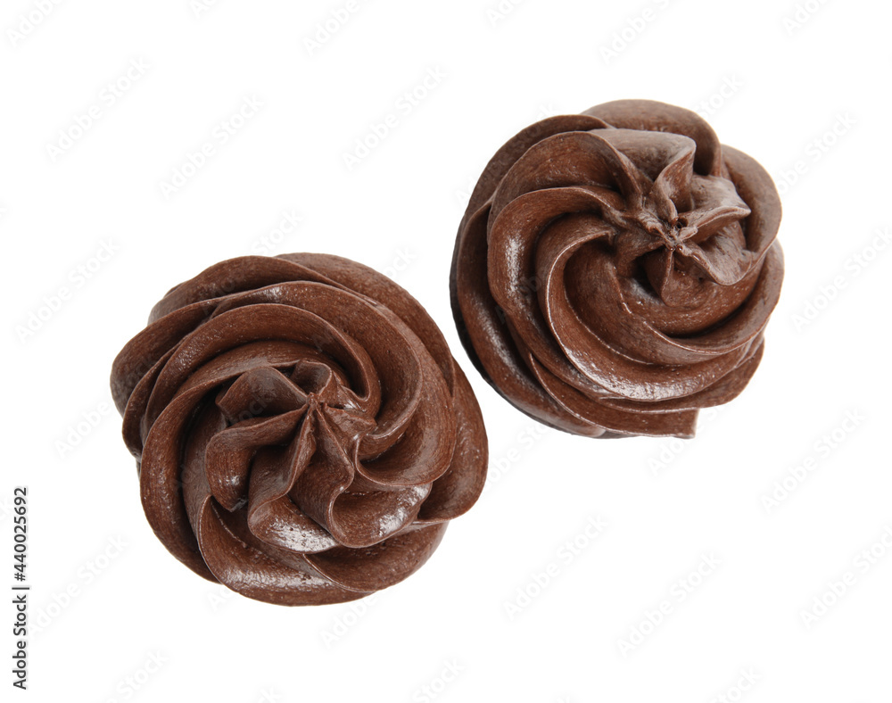 Delicious chocolate cupcakes with cream on white background, top view Delicious chocolate cupcakes with cream on white background, top view