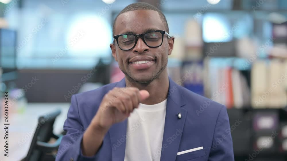 Portrait of African Businessman showing Thumbs Up Sign Portrait of African Businessman showing Thumbs Up Sign