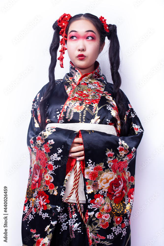 young pretty geisha in black kimono with sakura, asian ethno closeup on white background isolated young pretty geisha in black kimono with sakura, asian ethno closeup on white background isolated