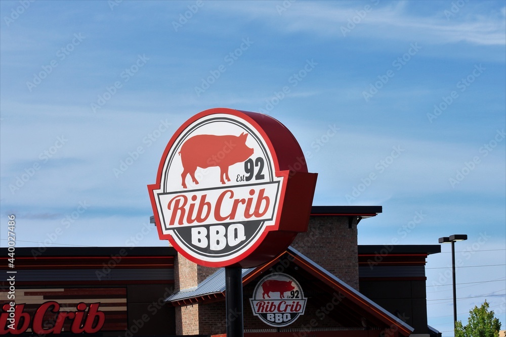 Rib Crib restaurant with an advertisement sign out side by the parking