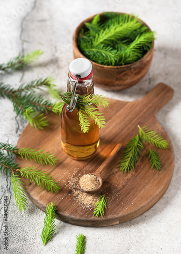 Homemade pine cough syrup made from green young fir tops and nature sugar. Alternative medicine concept.