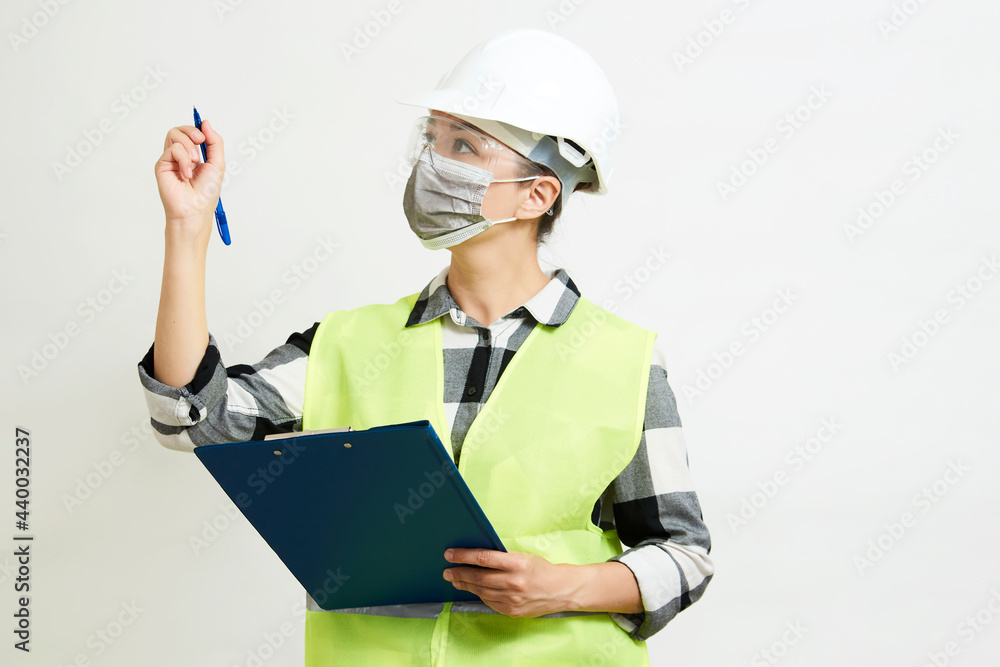Engineer woman worker with hard hat and paper clipboard Engineer woman worker with hard hat and paper clipboard