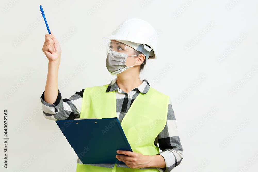 Engineer woman worker with hard hat and paper clipboard Engineer woman worker with hard hat and paper clipboard