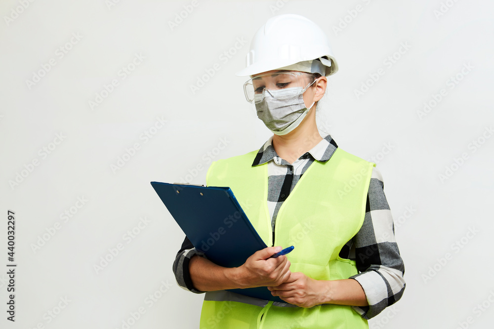 Engineer woman worker with hard hat and paper clipboard Engineer woman worker with hard hat and paper clipboard