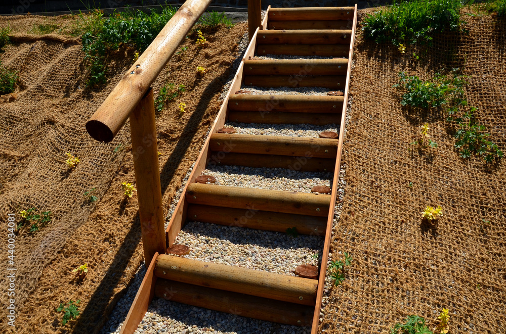 Φωτογραφία temporary covering of the lawn sowing with textiles to ensure a large slope against erosion