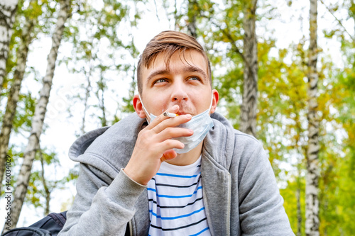 Young Man smoke a Cigarette