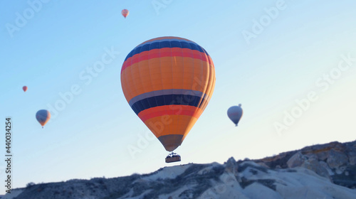 Hot air baloons preparing for take off. Famous sightseeing Cappadocia. Lights of air balloons.