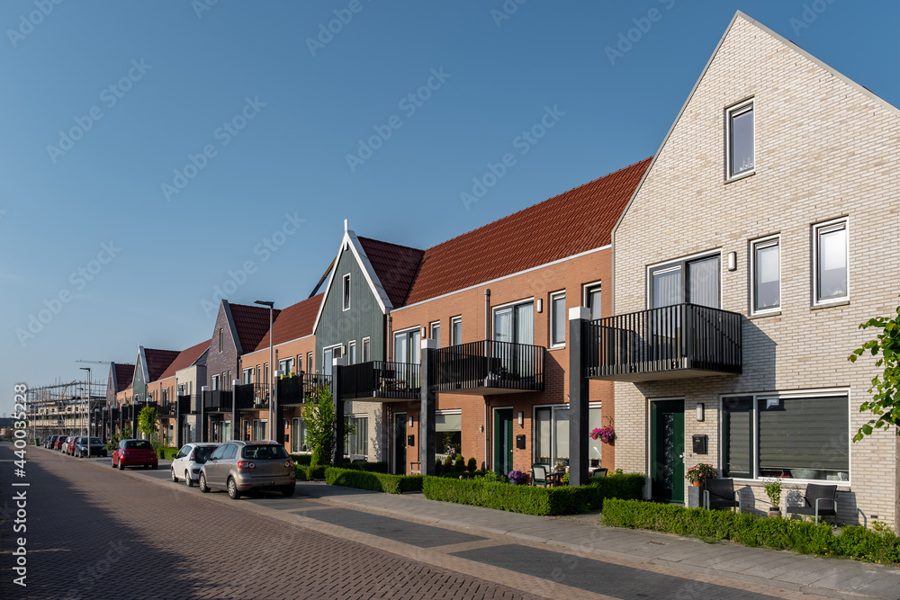 Dutch Suburban area with modern family houses, newly build modern family homes in the Netherlands, dutch family house, apartment house. Netherlands - obrazy, fototapety, plakaty 