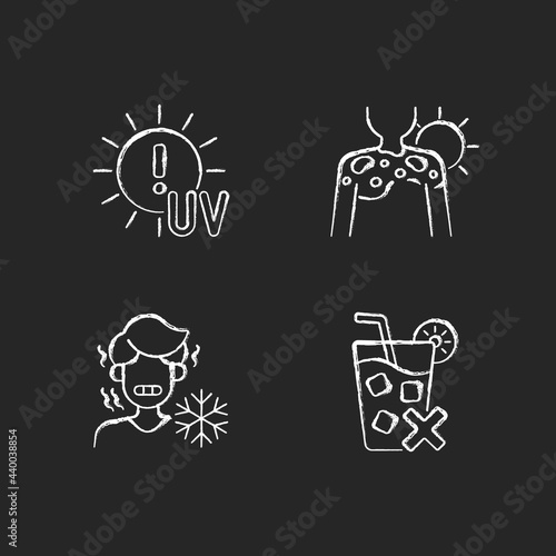 Sunburn risk chalk white icons set on dark background. UV rays exposure risk. Fluid filled blisters on skin from sunburn. Chills from heatstroke. Isolated vector chalkboard illustrations on black