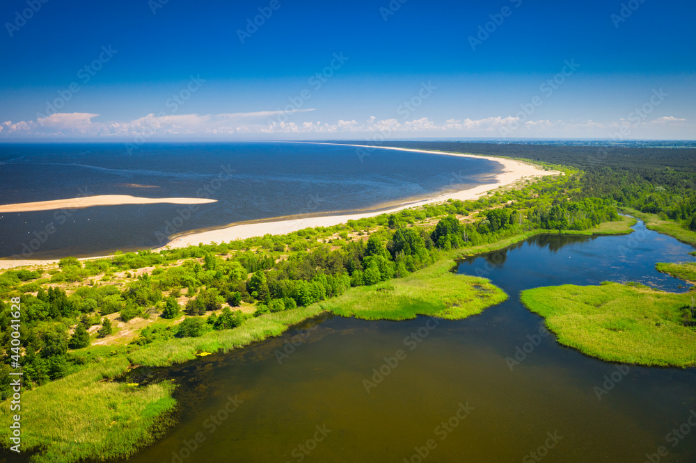 The beautiful scenery of the lake by the beach of the Baltic Sea, Mikoszewo. Poland The beautiful scenery of the lake by the beach of the Baltic Sea, Mikoszewo. Poland