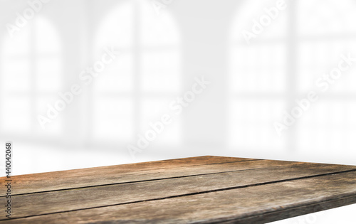 empty wooden table on background of abstract blur white interior  montage  product display  inside and window.