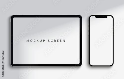 Realistic tablet and smartphone screen mockup with shadow on top of devices. Vector illustration with high detail.