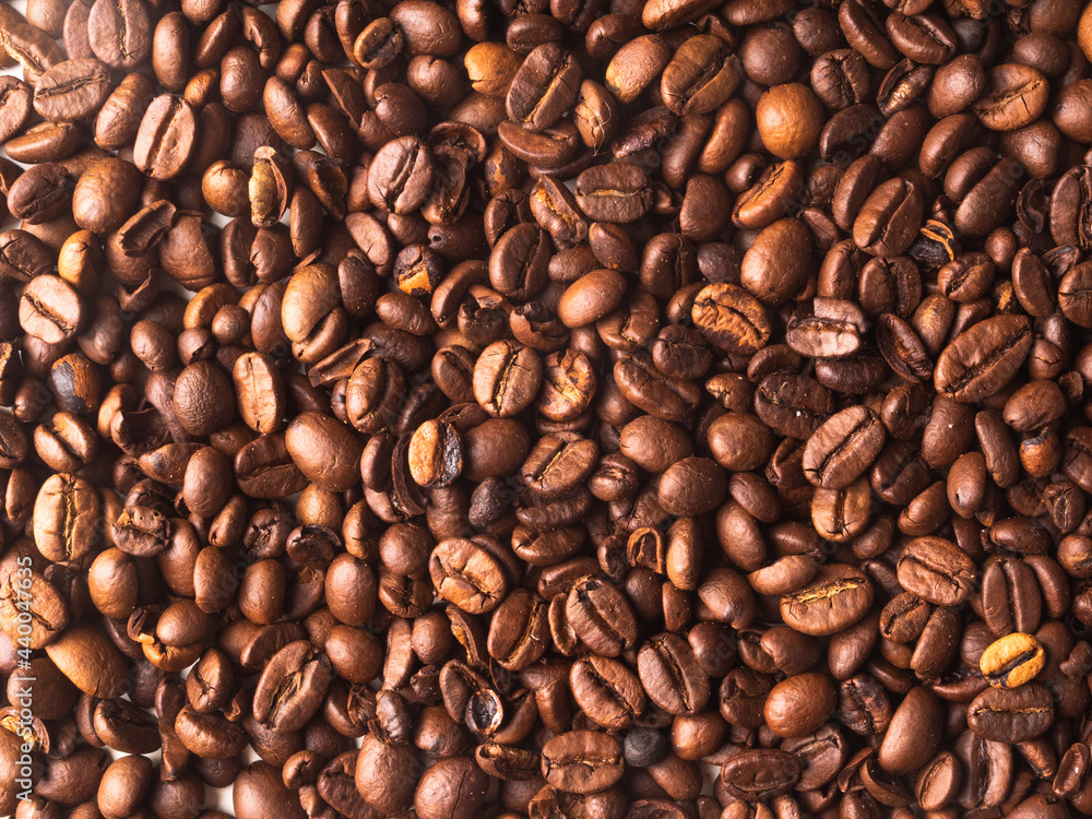 Obraz premium Aromatic roasted coffe beans for background