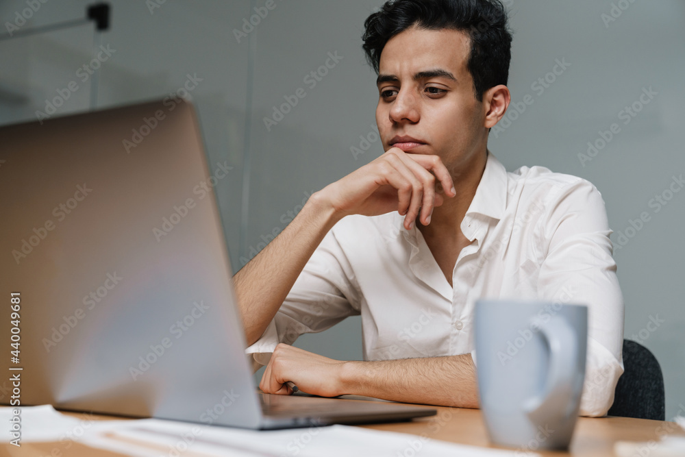 Brunette mid aged businessman wearing white shirt Brunette mid aged businessman wearing white shirt