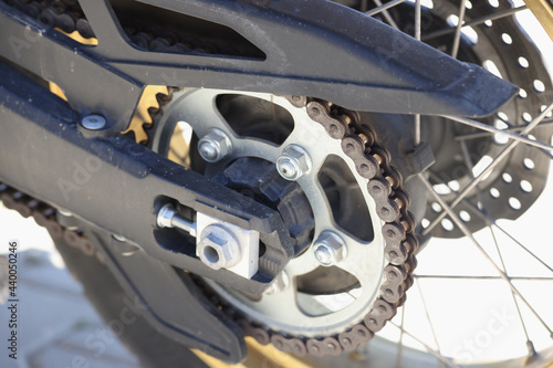 Detail of the rear chain of motorcycle with brake disc