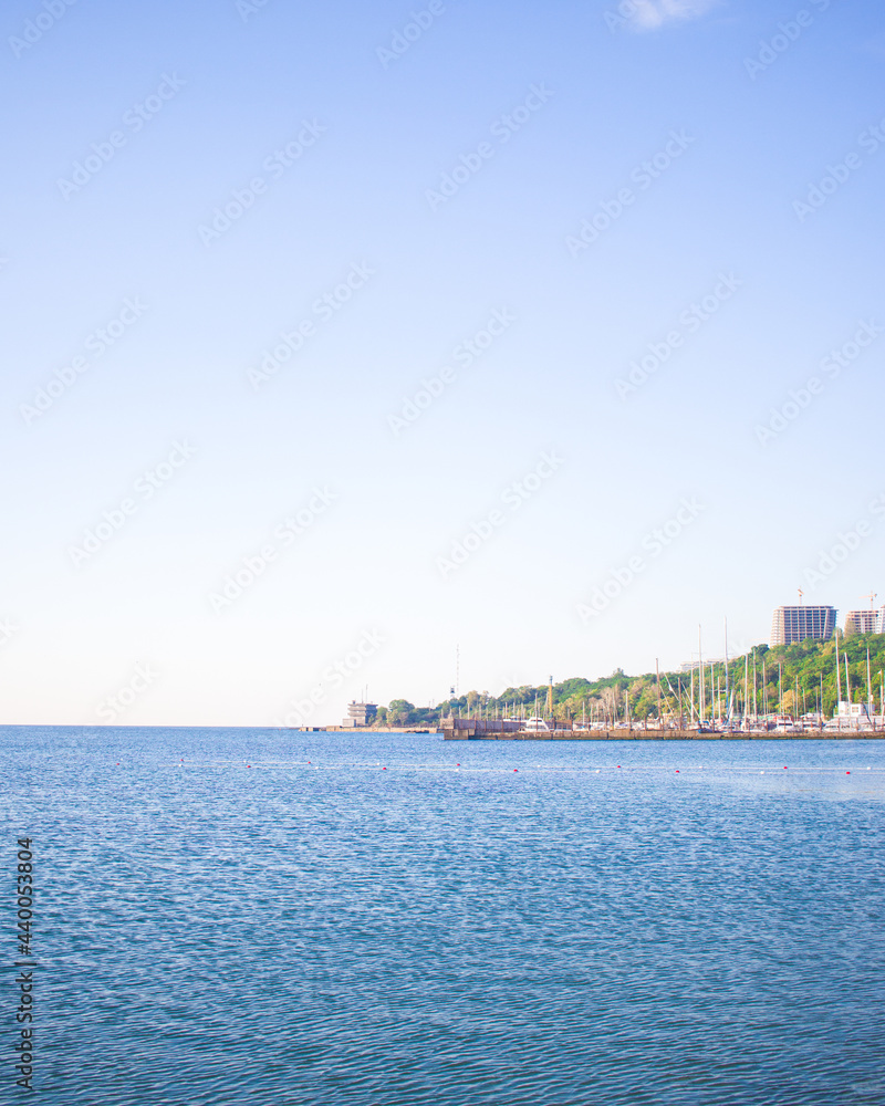 Pier on the background of the blue sea. Yarsky sunny summer day