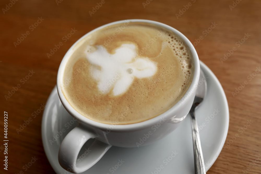 Obraz premium Cup of cappuccino on wooden table