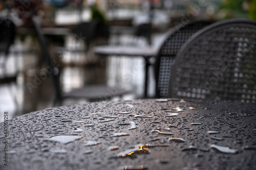 Street cafe table wet from the rain