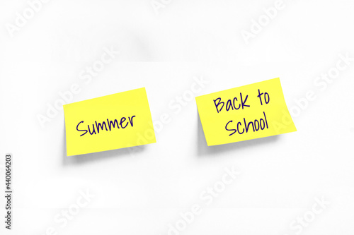 Two Yellow stickers with Summer and Back to School Handwriting text on white Whatman paper. Concept of work, programming, testing, business. Handwriting text, copy space