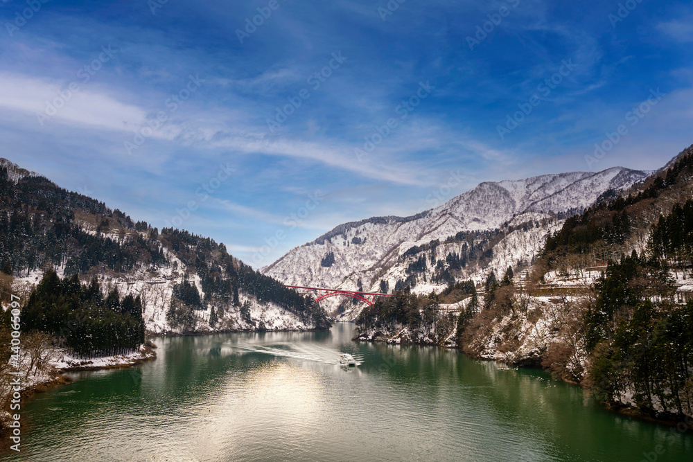 Beautiful landscape from Shogawa Gorge Cruise. A cruise ship on the Shogawa. Toyama is located in Japan Beautiful landscape from Shogawa Gorge Cruise. A cruise ship on the Shogawa. Toyama is located in Japan