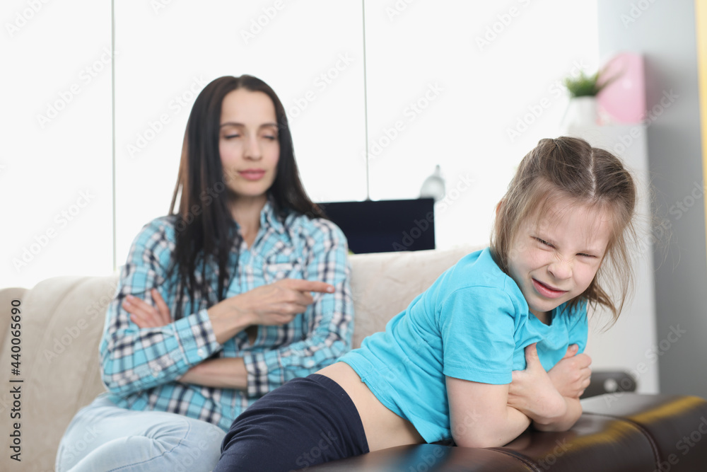 Mother scolding naughty little girl at home Mother scolding naughty little girl at home