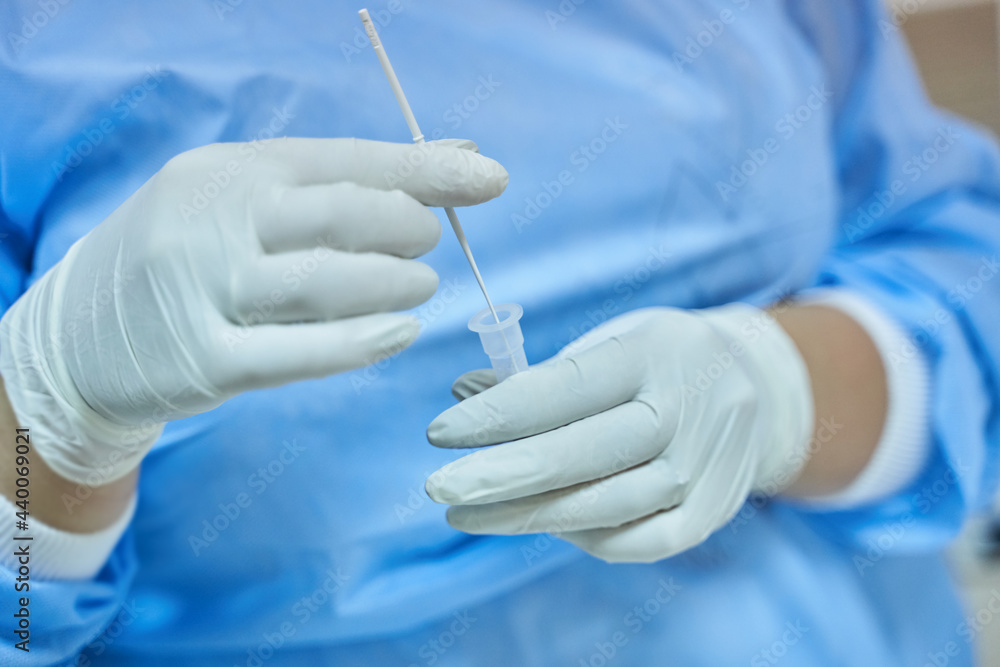 Nurse Mixing COVID-19 Rapid Test Swab Nurse Mixing COVID-19 Rapid Test Swab