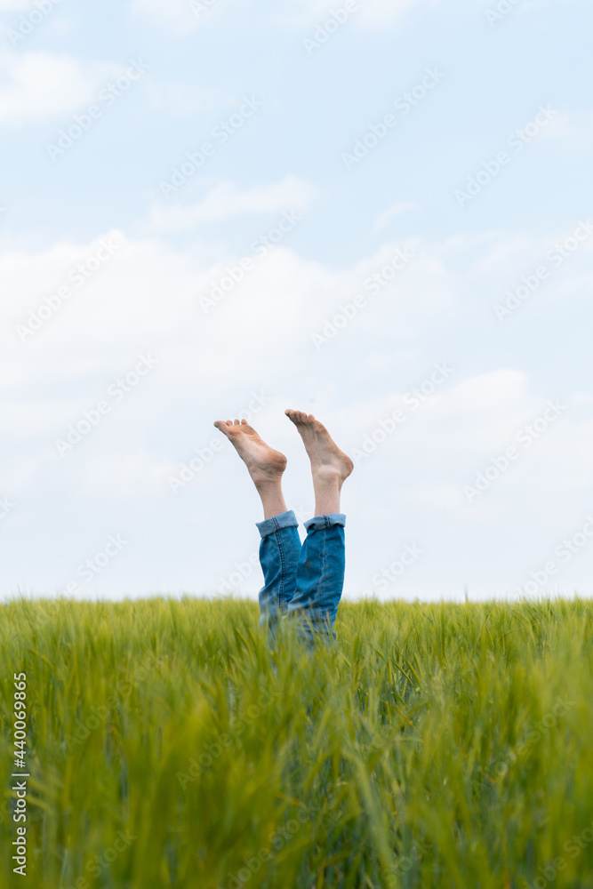 Bare feet above green field grass Bare feet above green field grass