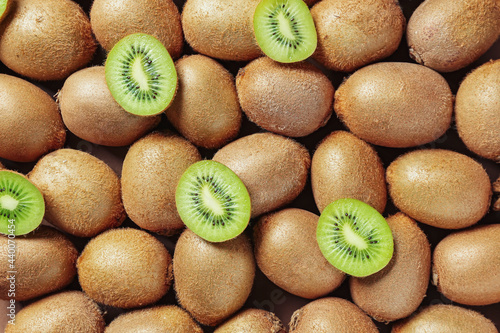 Many ripe kiwi as background photo